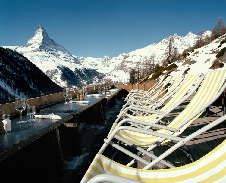 Sip cocktails to a Matterhorn backdrop in Zermatt town. Image by Tim Macpherson/Photostock/Getty