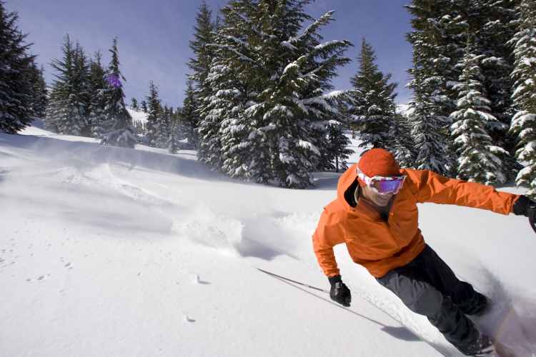 Fresh, deep powder on a sunny day at Kirkwood Mountain Resort, California. Image by Jose Azel / Aurora / Getty Images.