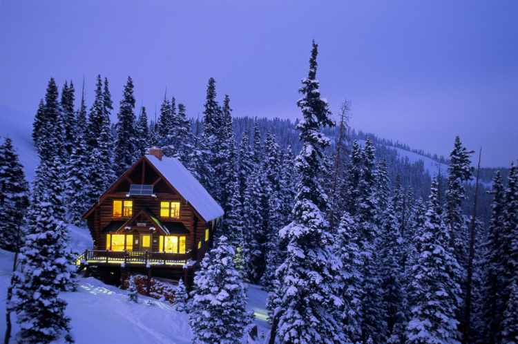 Snow-covered ski cabin at Copper Mountain Resort, Colorado. Image by David Hiser / Stone / Getty Images.