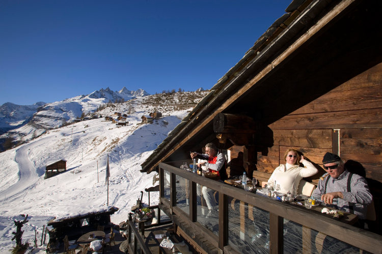 Kick back on the terrace at Chez Vrony. Image by Ingolf Pompe/Photostock/Getty