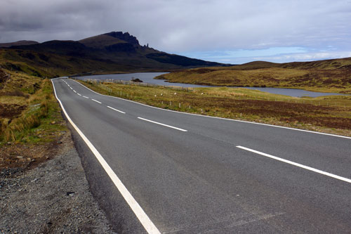 The A855 heading north toward the Old Man of Storr. Image by James Kay / Lonely Planet