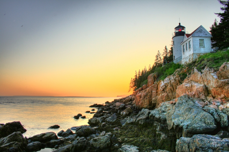 A lighthouse at sunrise in Acadia National Park in Maine.