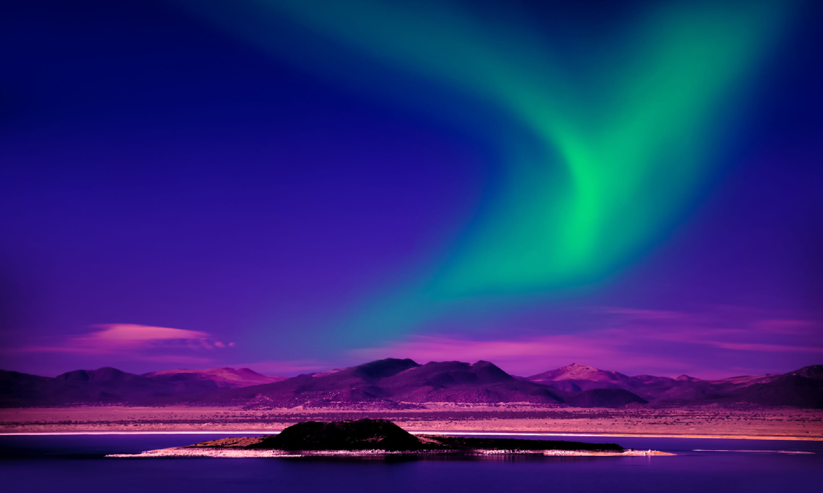 Northern Lights over lake (Shutterstock)