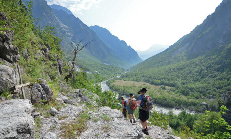 Hikers head along the river valley to the village of Nderlysaj (Phoebe Smith)