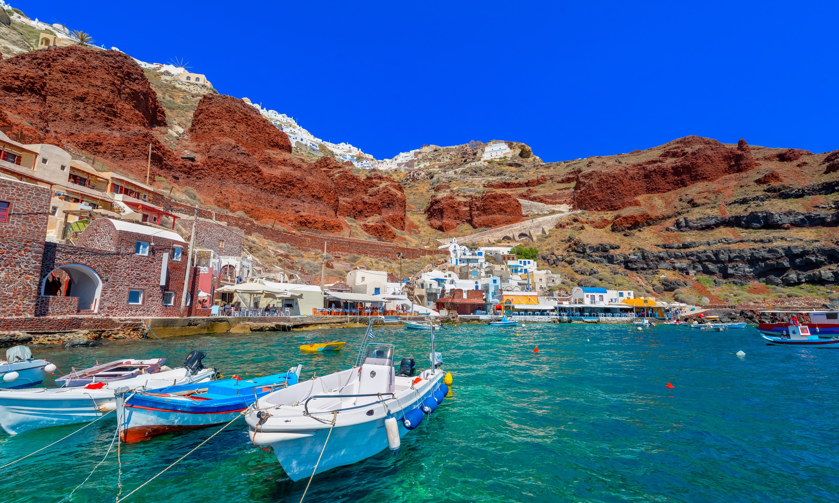 Ammoudi village, Santorini, with fishing boats (Shutterstock.com)