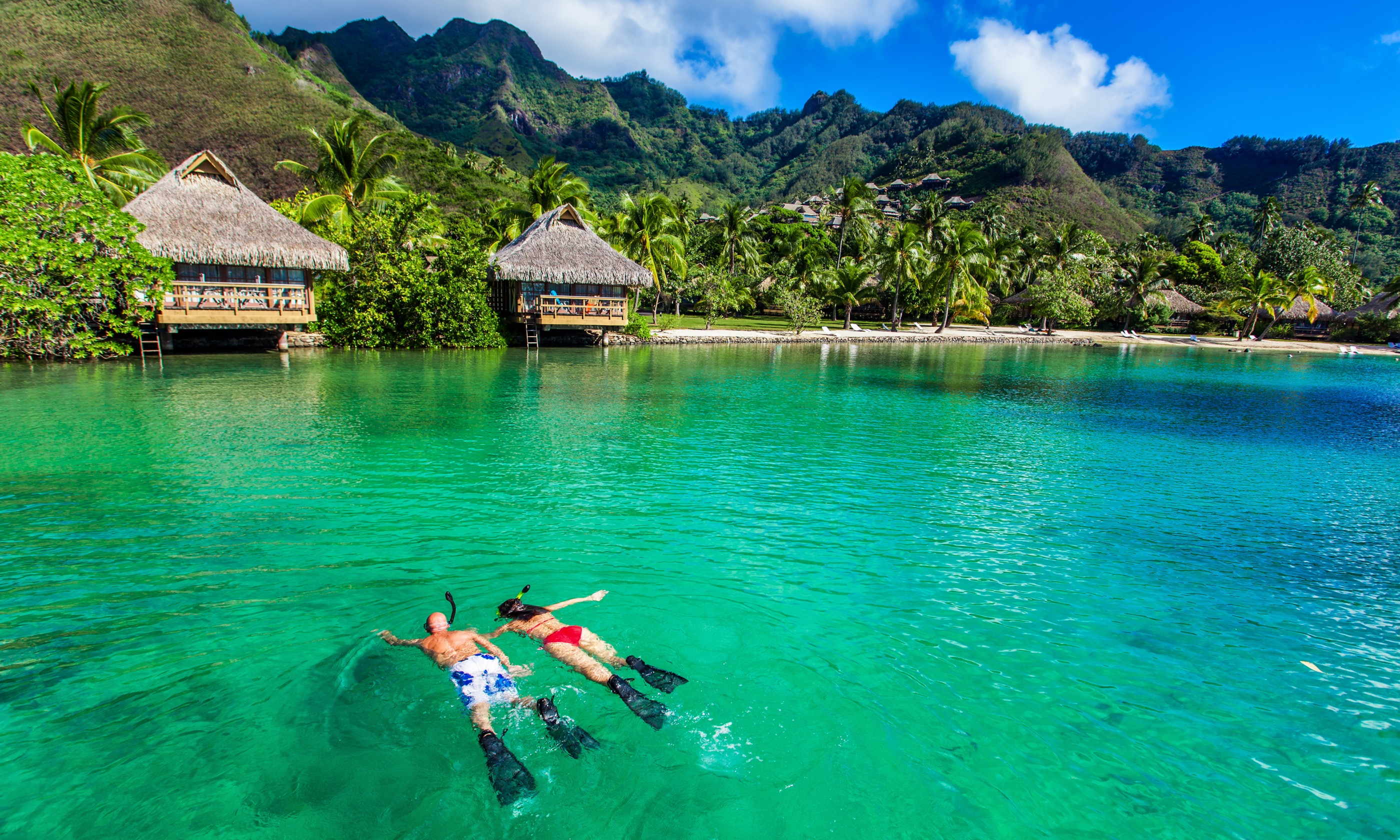 Snorkelling near overwater villas (Shutterstock.com)