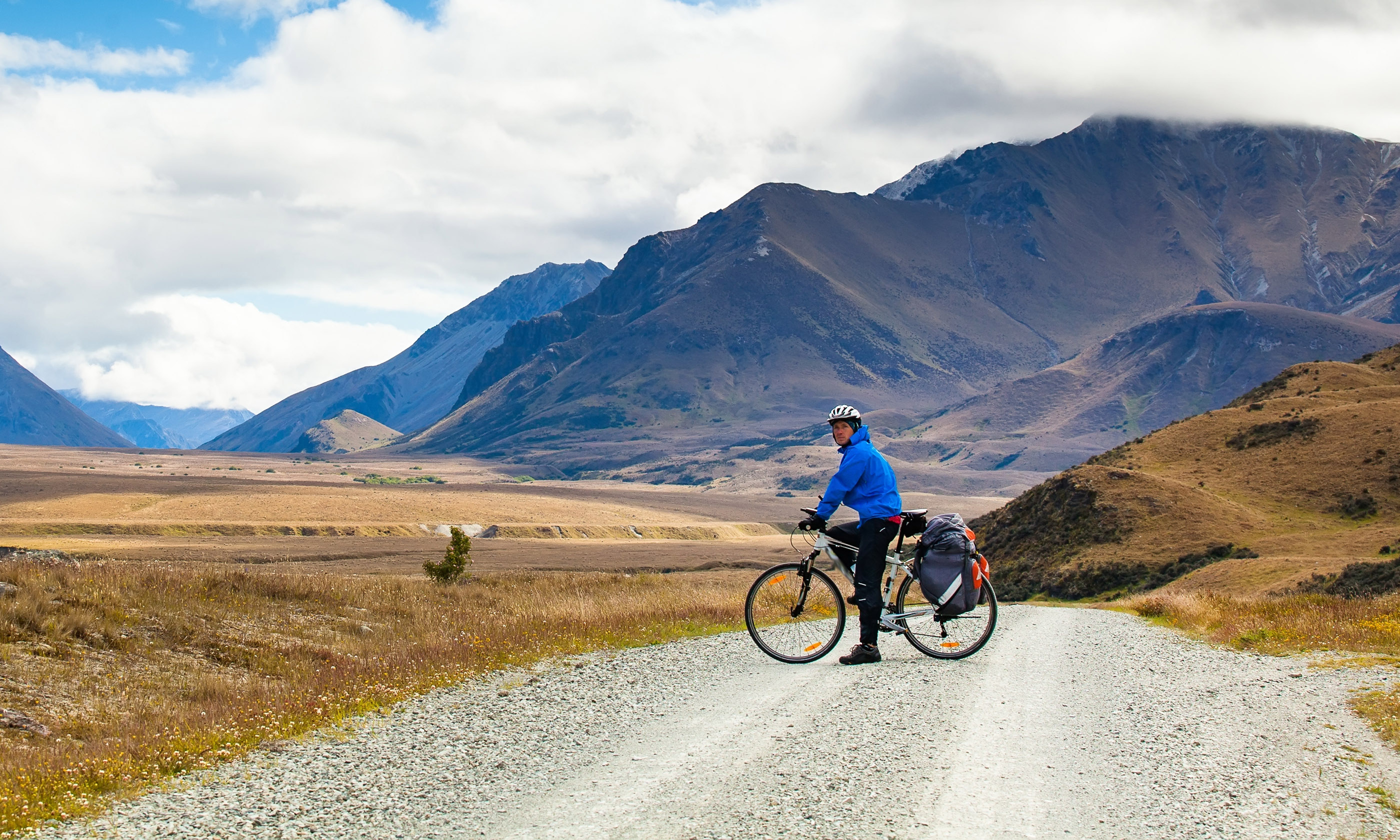 A cyclist in New Zealand's Southern Alps (Shutterstock)