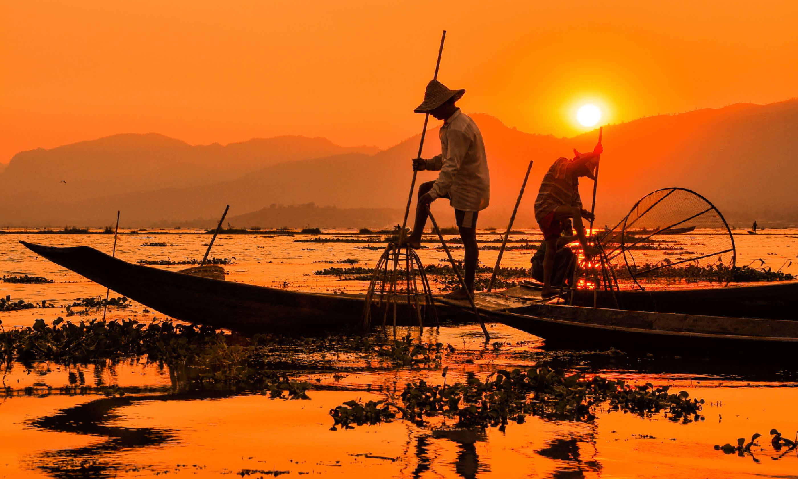 Fishermen in Inle lakes sunset (Shutterstock: see credit below)