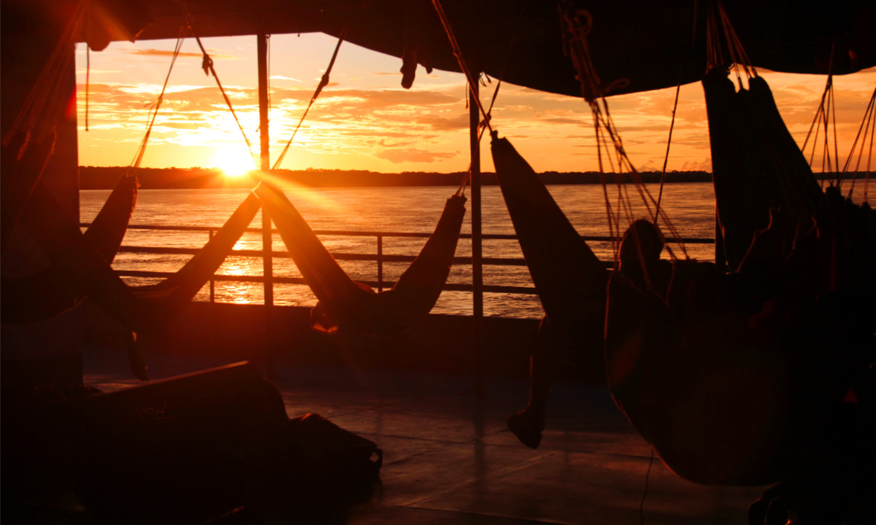 Amazonian sunset from boat hammock (Bobaroundtheworld.com)