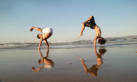 Martial arts dancers on the beach in Capoeira (freeflyer09)