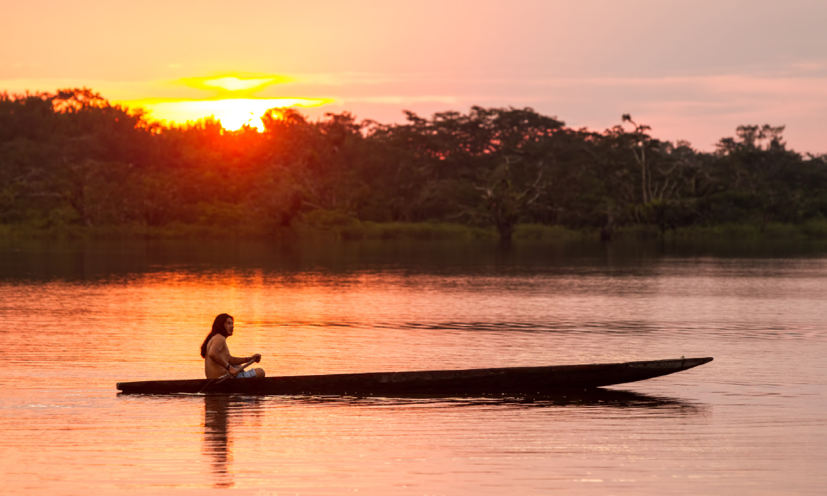 Canoeing on Laguna Grande, Cuyabeno NP, Ecuador (Shutterstock: see credit below)
