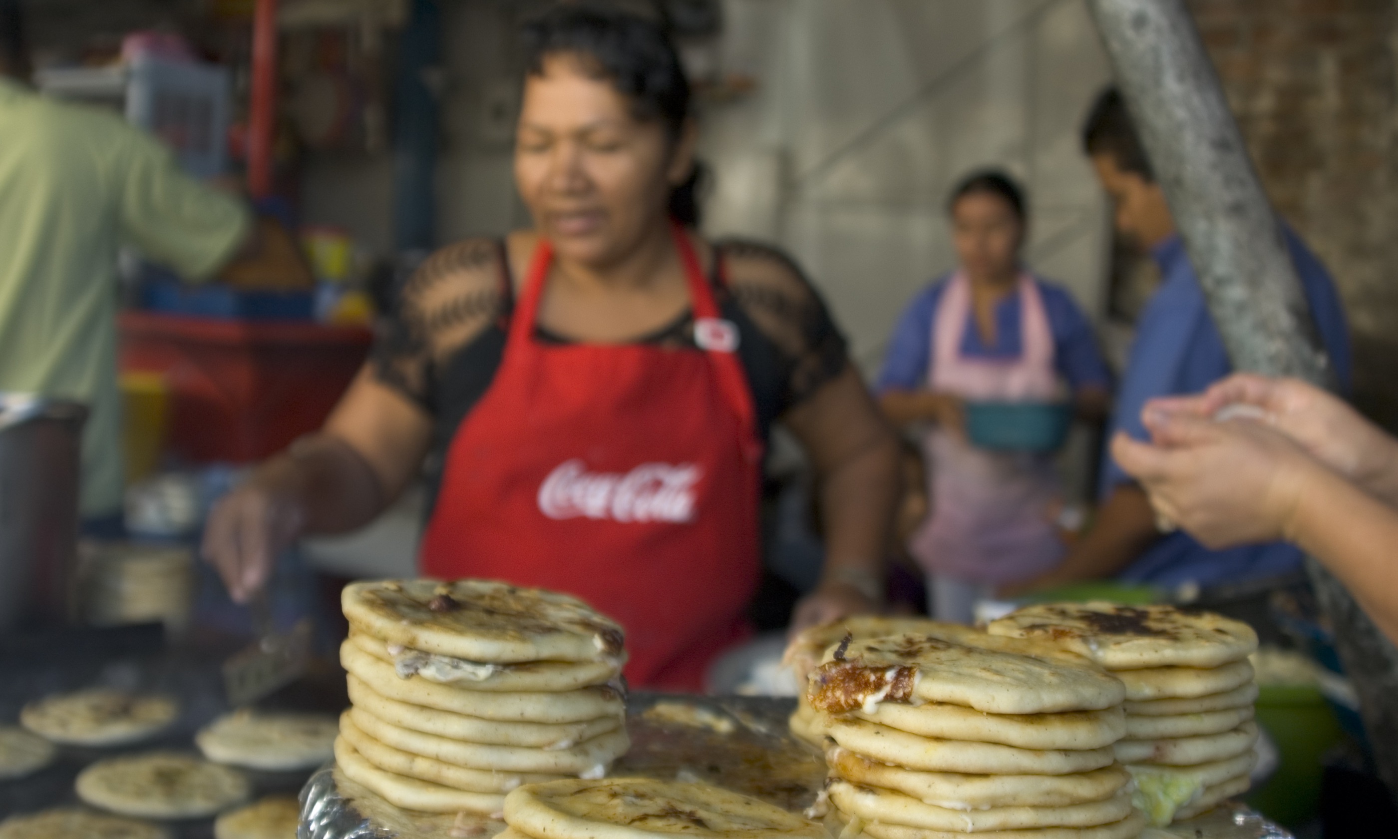 Pupusa seller (Shutterstock.com)