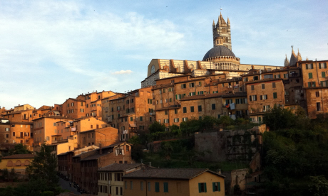 Siena at sunset is bathed in a warming orange glow (Daisy Cropper)