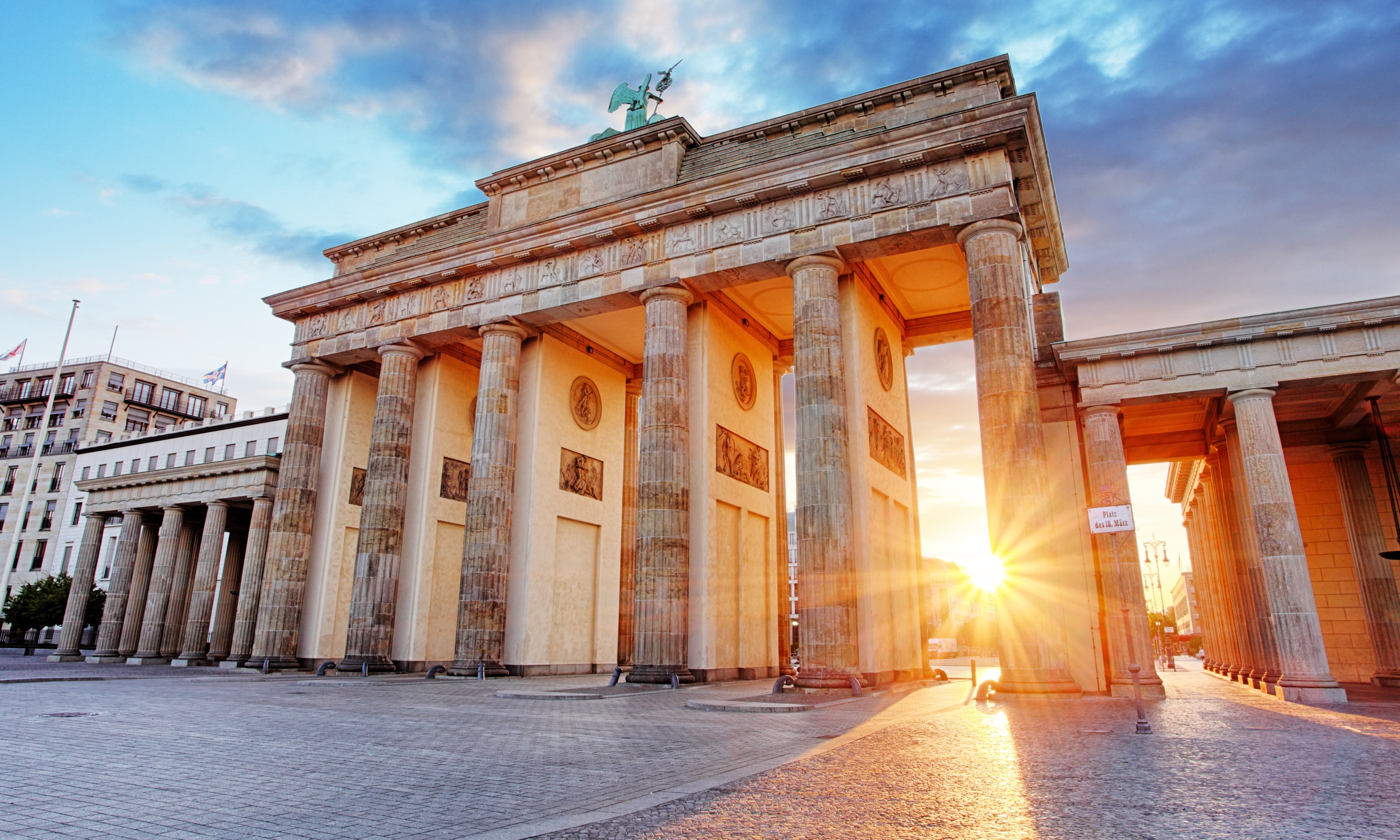 Sun shining through Brandenberg Gate (Shutterstock.com)