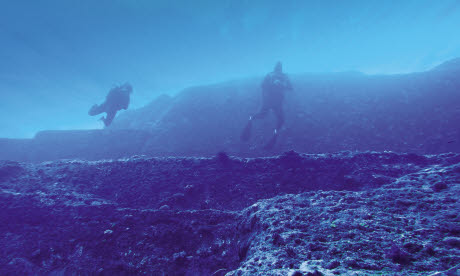 Divers float above the submerged stone structures of Yonaguni (Image: Raf Jah)