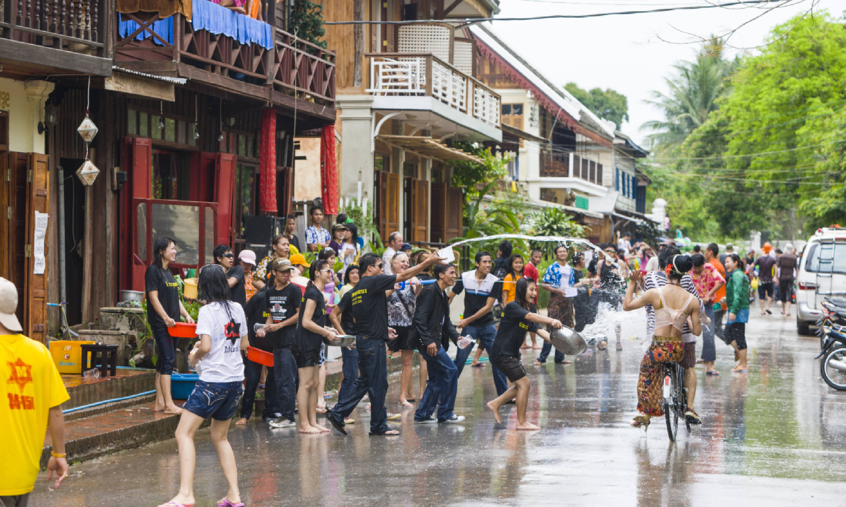 People throw water on each other as part of the New Year festival (Shutterstock)