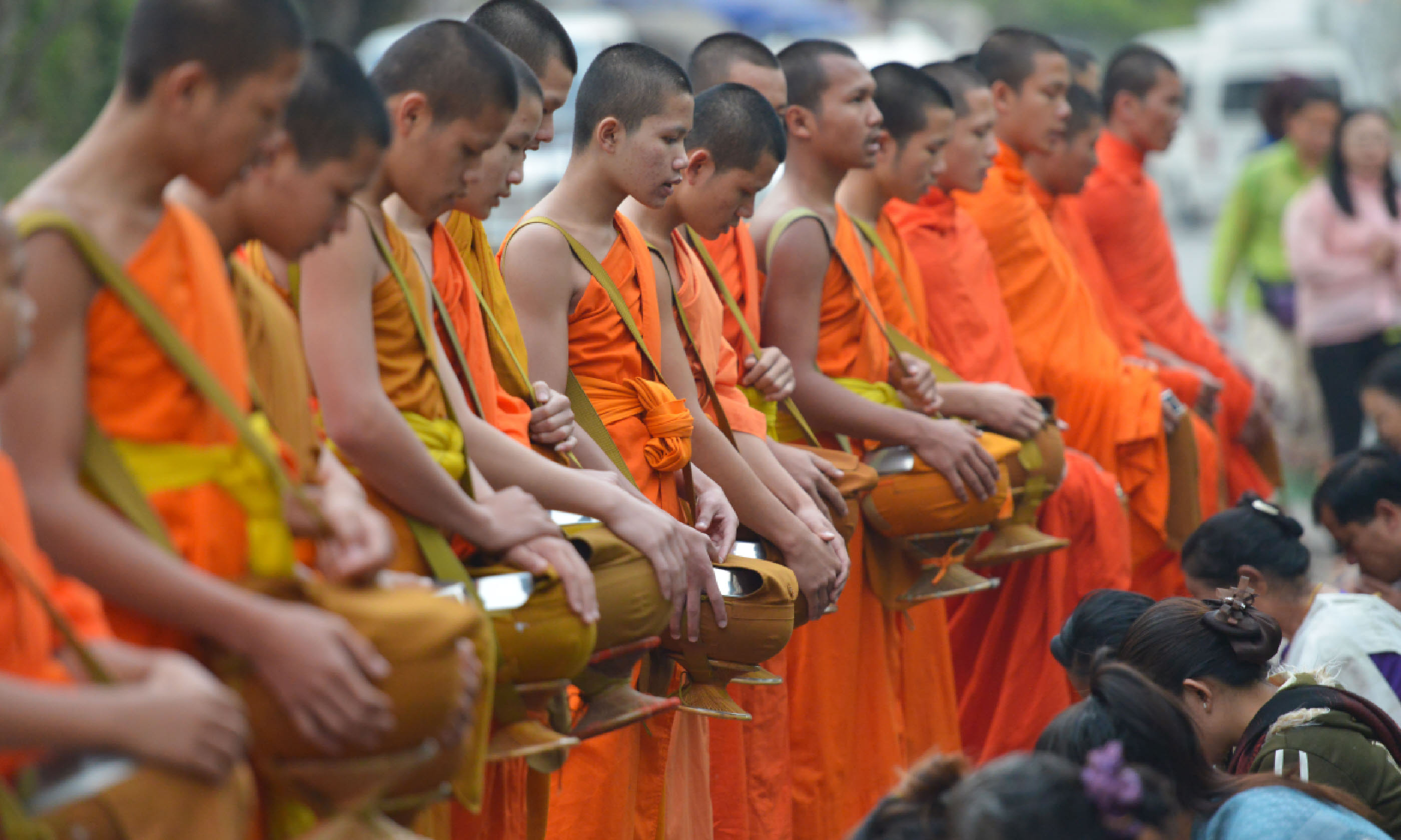 Monks collenting alms, Laos (Shutterstock)