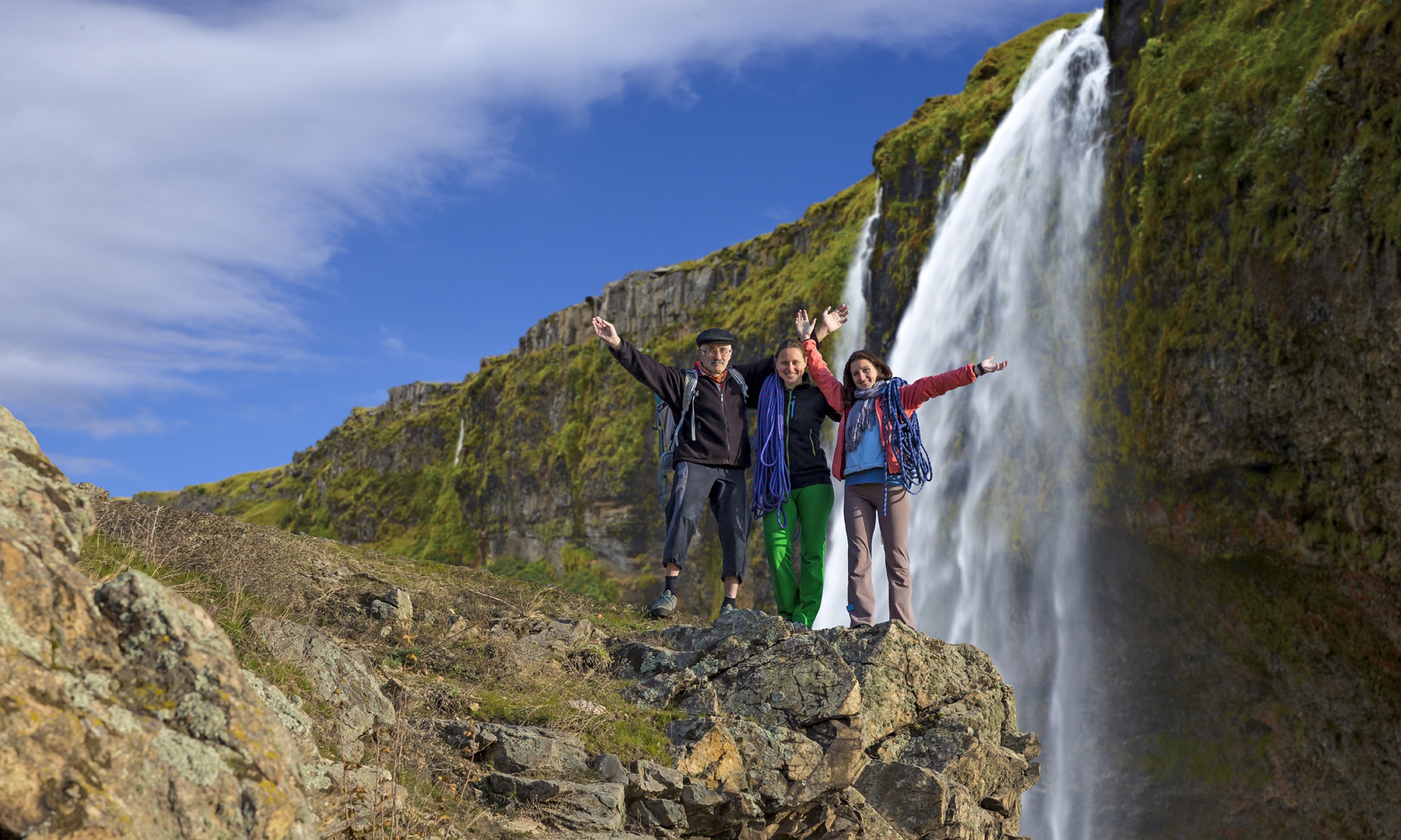 Family near waterfall in Iceland (Shutterstock.com. See main credit below)