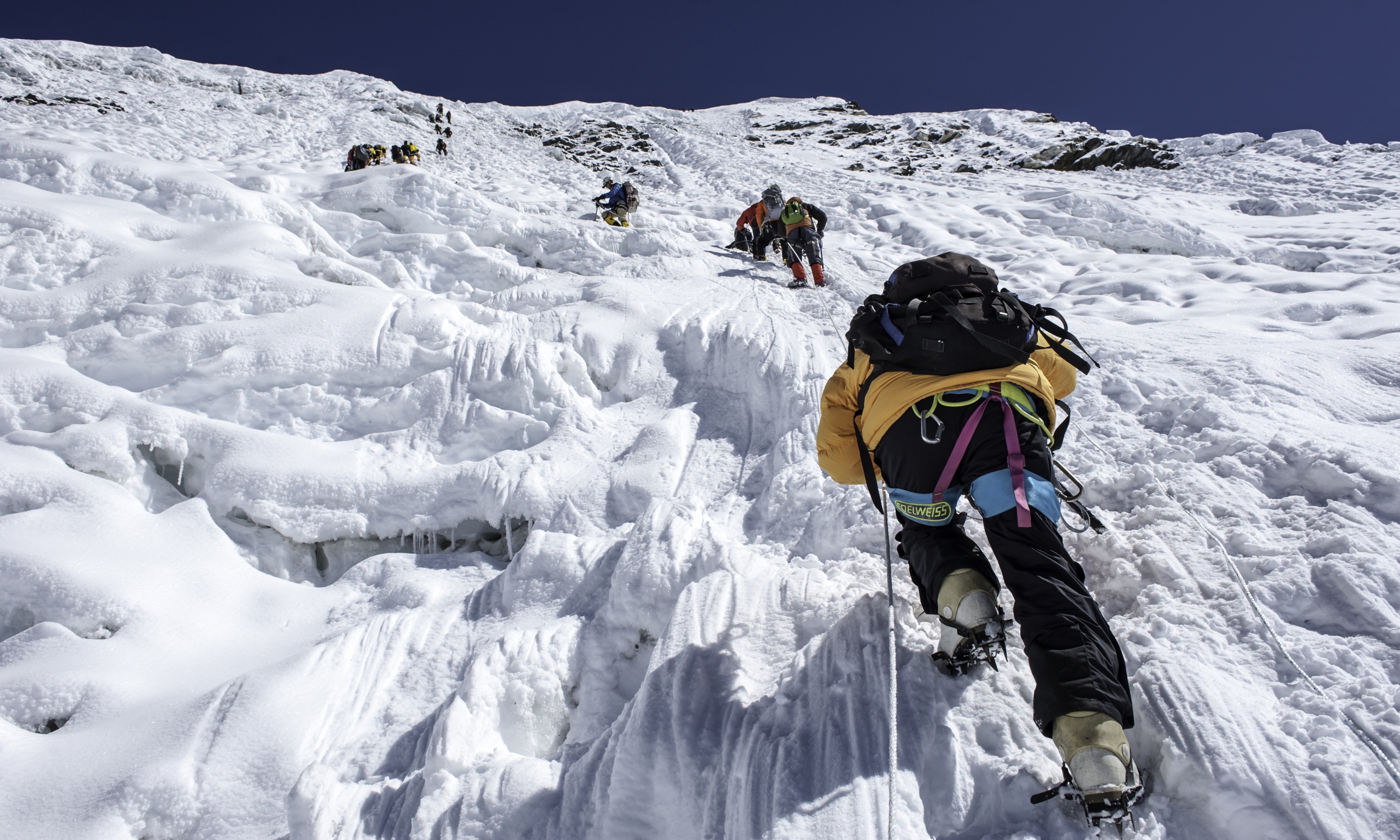 Climbing with ice pics (Shutterstock.com)