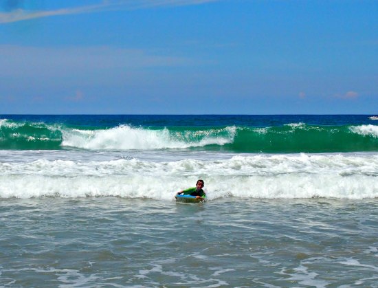 Body boarding at Kovalam beach, India, Kerala. Family beach fun!