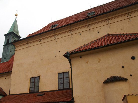 Highlights of Prague for kids. Cannonballs in the wall on a Prague Tour 