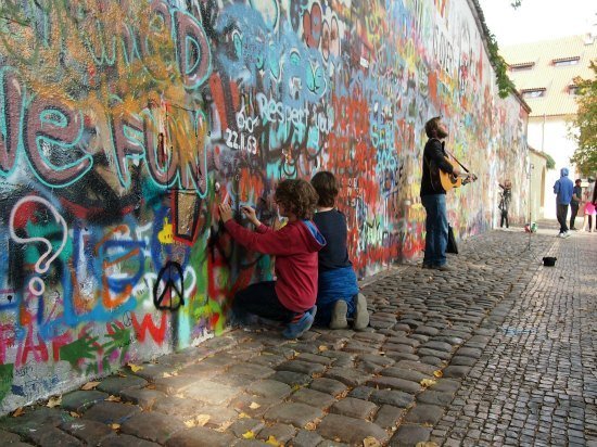  One of the highlights of Prague on our child-focussed city tour. Art at the Lennon wall as a busker played Imagine.