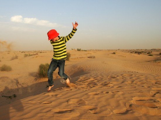 Enjoying the sand dunes on our camel safari in the desert. Dubai