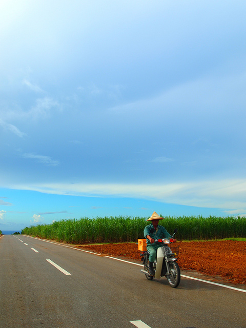 Kume Island Man on Scooter (photo: A Shino/flickr)