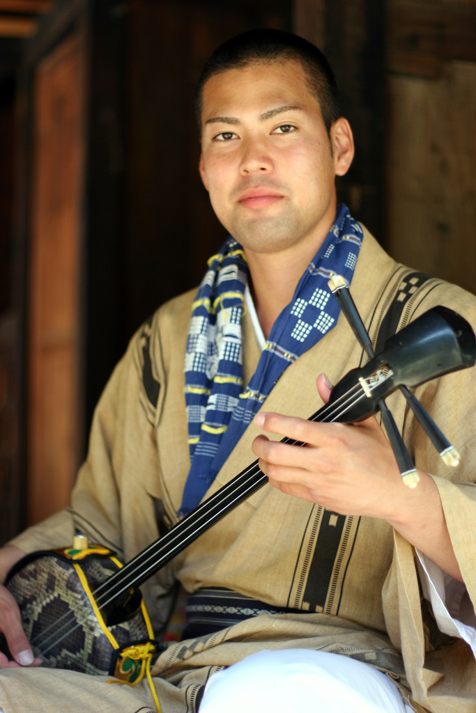 sanshin player at Beginning a dance at Ryukyu Mura