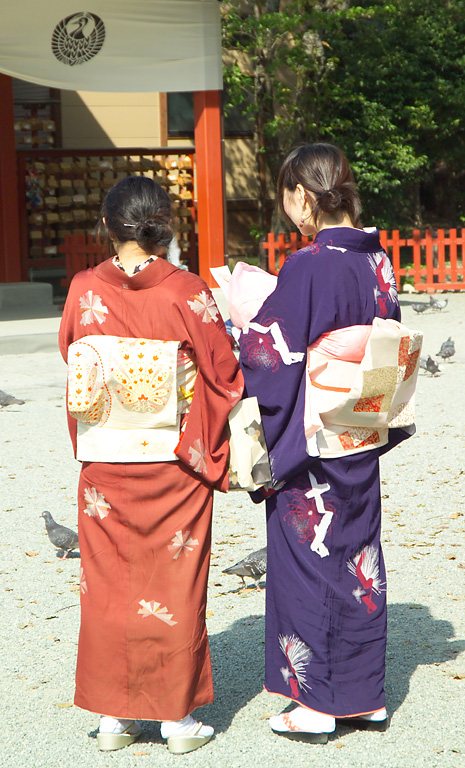 Girls read their fortunes at Tsurugaoka Hachim...