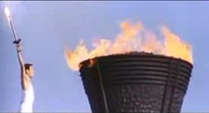 Yoshinori Sakai lights the Olympic cauldron