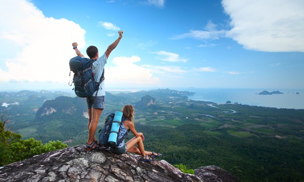 Backpackers atop a mountain (Shutterstock,com)