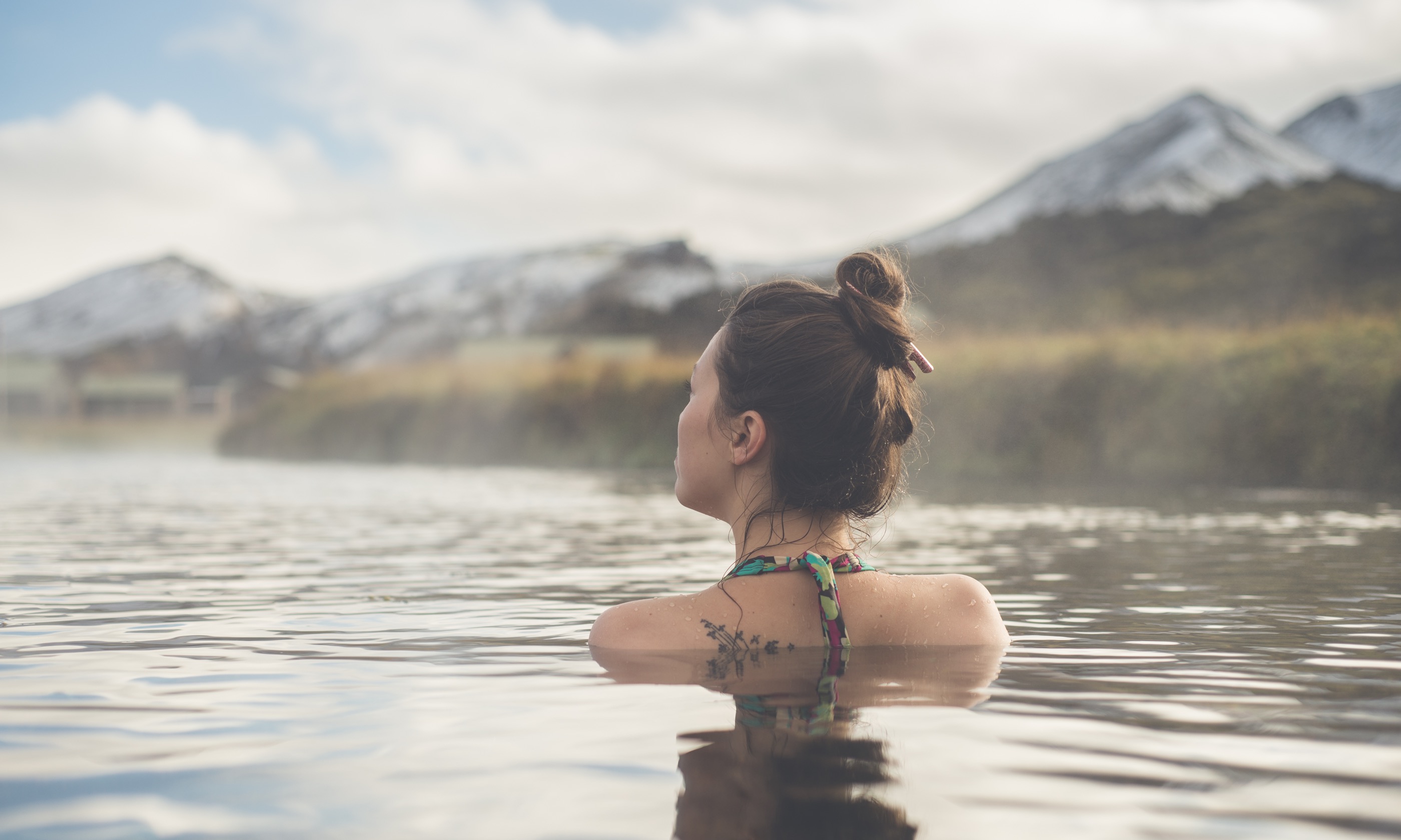 Relaxing in a hoot pool in Iceland (Shutterstock.com)