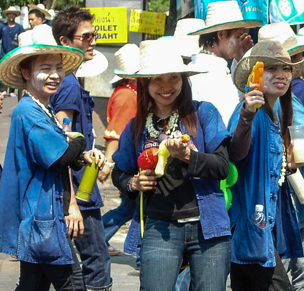 Smiling assassins with water pistols during the Songkran Water Festival