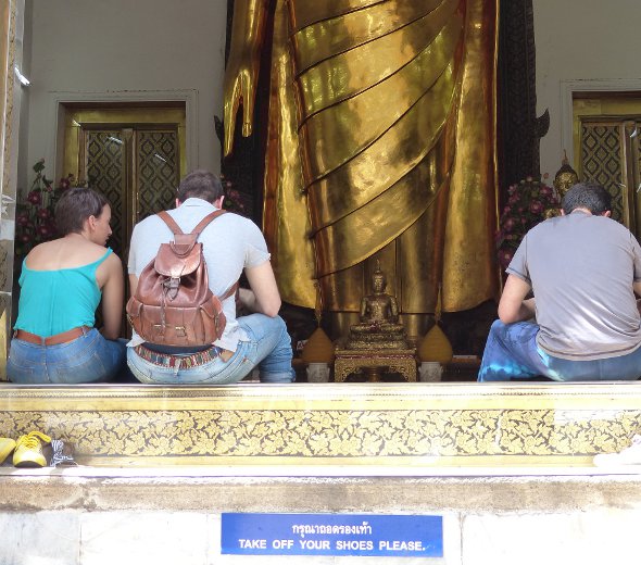 Don't step on (or sit on) the threshold of a temple or house in Thailand