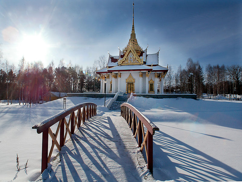 A snow-covered winter scene at the Royal Thai Pavilion in Utanade, Sweden