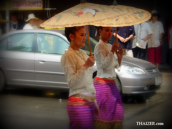 Two Thai ladies carrying parasols during Songkran in Chiang Mai