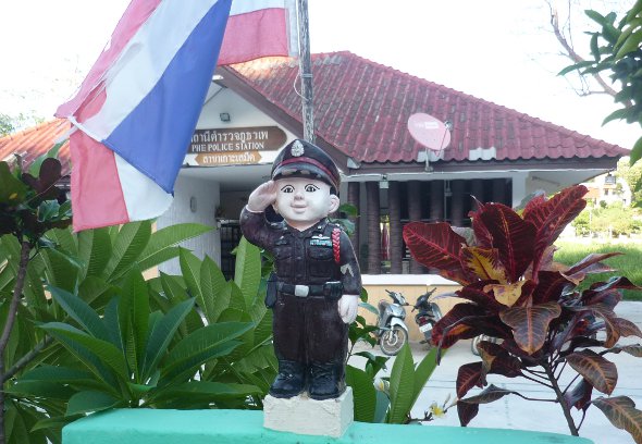 mini policeman on duty in front of police station on Ko Samet