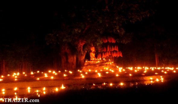 lighted candles at Wat Pan Tao in Chiang Mai