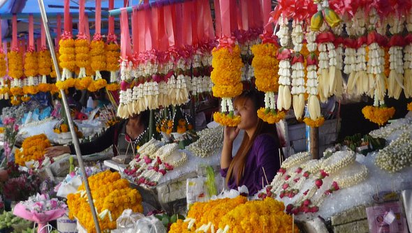flower garlands for sale at market in Thailand