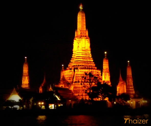 Wat Arun in Bangkok viewed from dinner cruise boat on Chao Phraya River