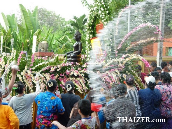 Blessing Buddha images with water during Songkran in Thailand