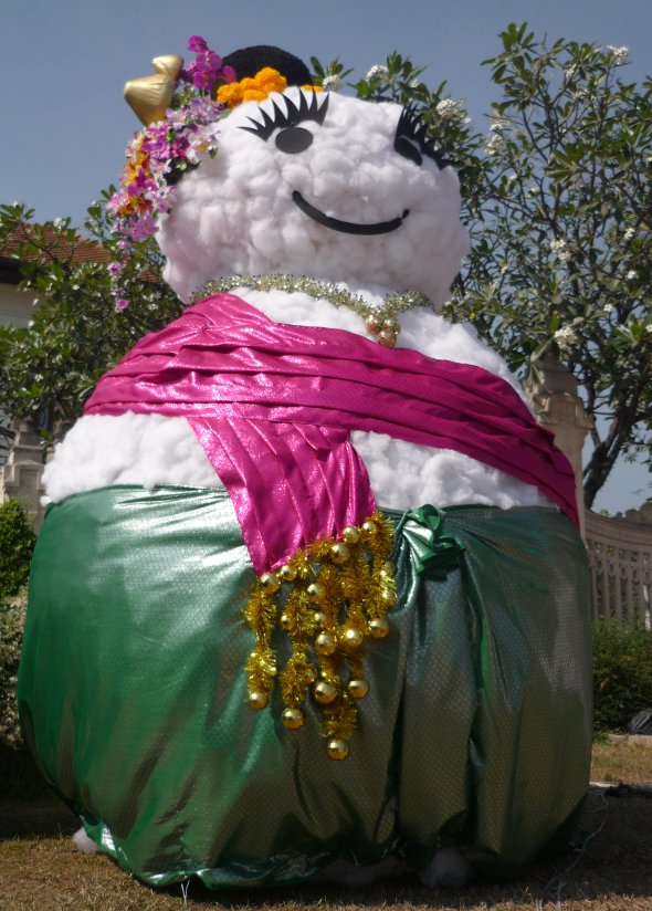 Snow-woman dressed in traditional northern Thai costume in Chiang Mai