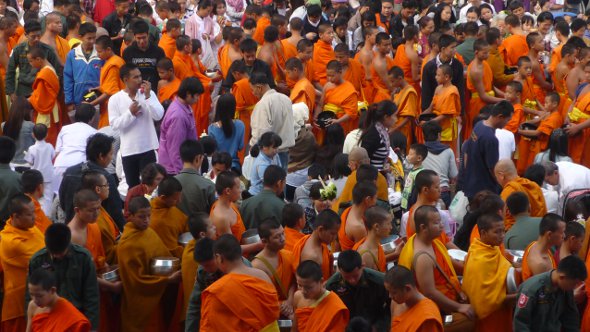 monks line up for alms in Chiang Mai