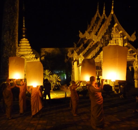 monks at Wat Chedi Luang in Chiang mai prepare to release 'khom loy' sky lanterns