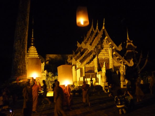 Monks release khom loy sky lanterns at Wat Chedi Luang, Chiang Mai