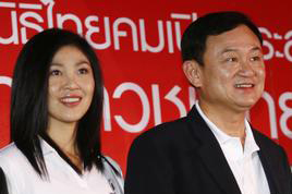 Yingluck Shinawatra pictured with her older brother, Thaksin Shinawatra