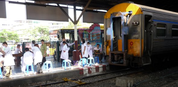 getting a trim at Bangkok Hualamphong train station