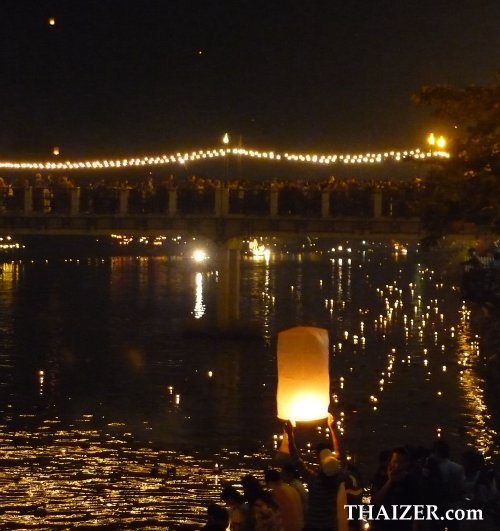 releasing khom loy sky lanterns for Loy Krathong