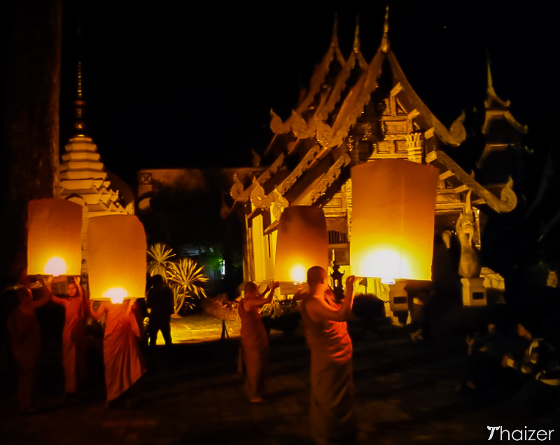 monks prepare to release khom loy sky lanterns in Chiang Mai